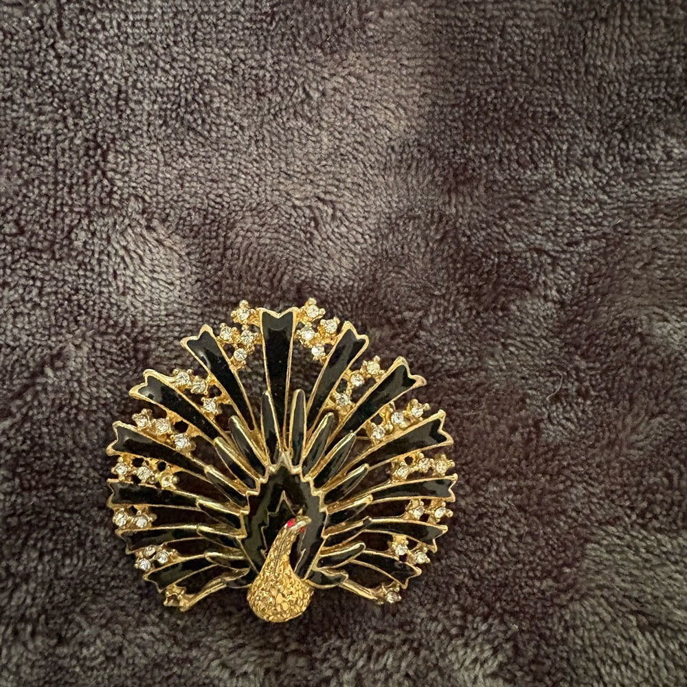Elegant Gold and Black Peacock Brooch